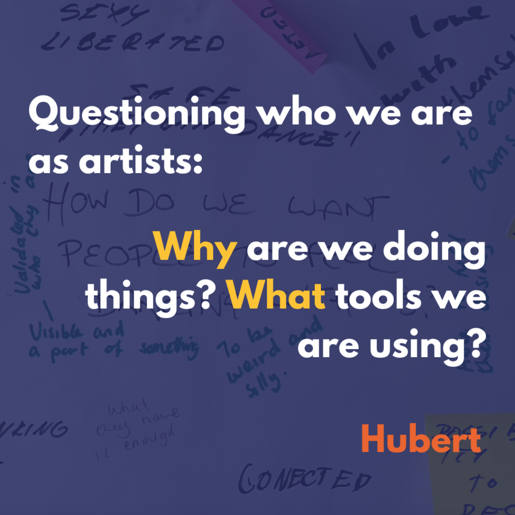 This text written on a semi-transparent blue background laid over image of black writing and colourful post-it notes on white paper: Questioning who we are as artists, Why are we doing things? What tools are we using? Hubert