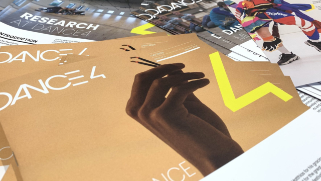 Dance4 brochures laid out on a table.