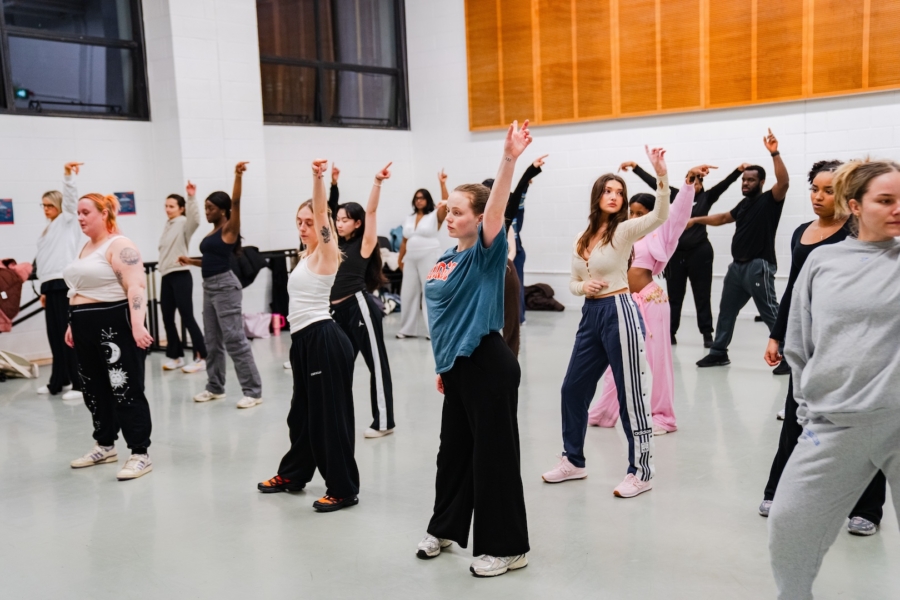 Dance students rehearsing in a rehearsal space.